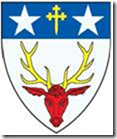 Argent, a stag’s head cabossed Gules attired Or and on a chief Azure a cross crosslet fitchy Or between two spur-rowells Argent Cannot find any crest part of this.